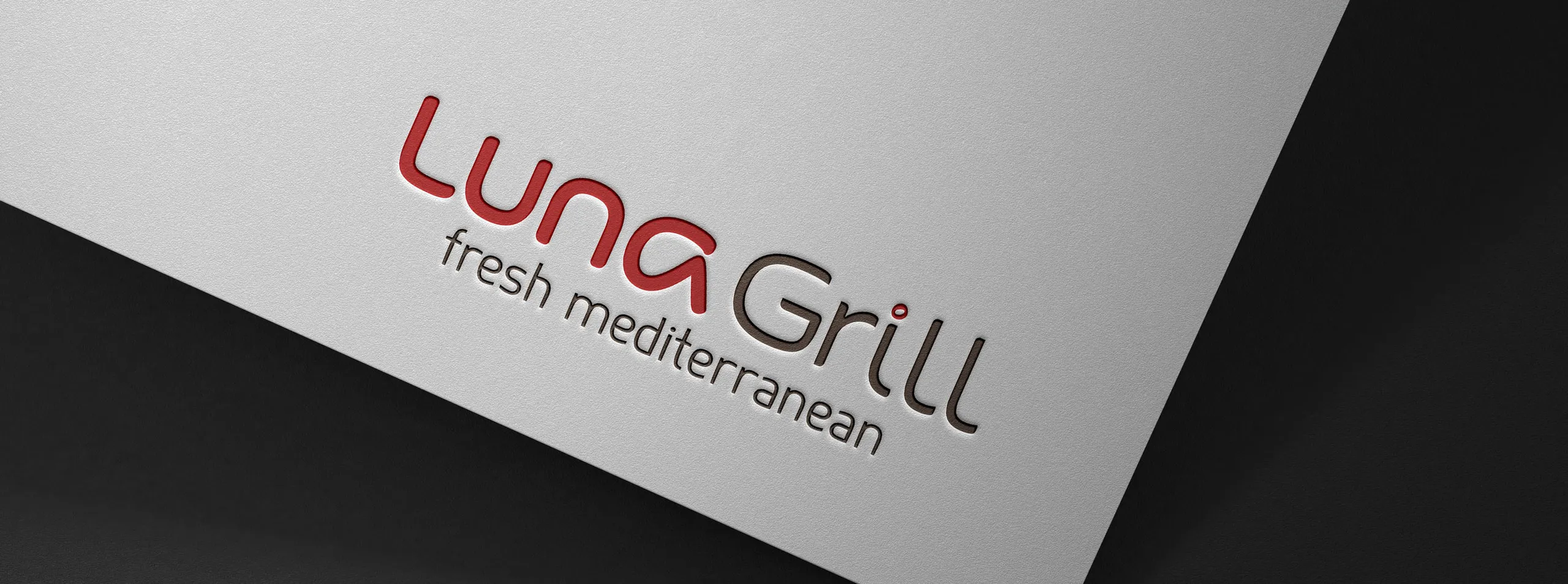 The Luna Grill wordmark with its fresh mediterranean descriptor debossed on paper