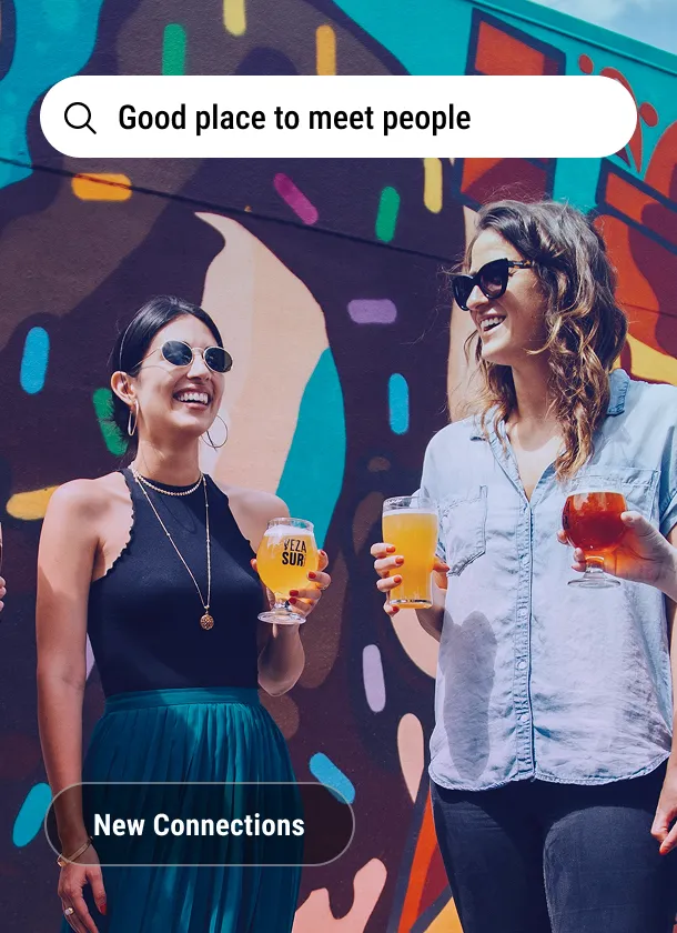 Imagery card: two people with drinks in front of a mural under the search line Good place to meet people, tagged New Connections