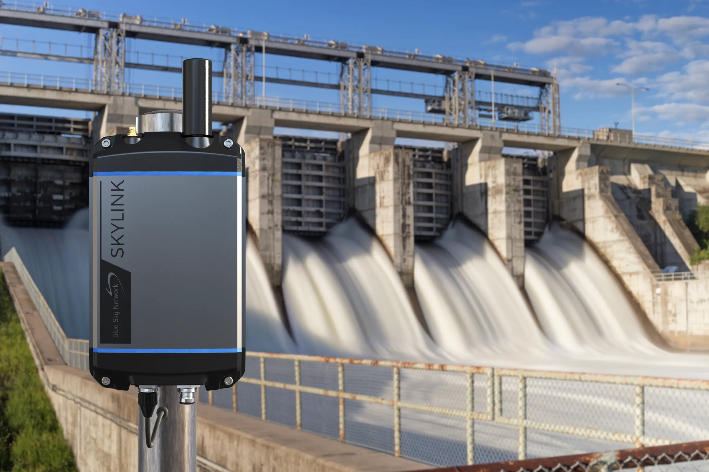 An environment composite showing a SkyLink unit mounted at a hydroelectric dam above the spillway.