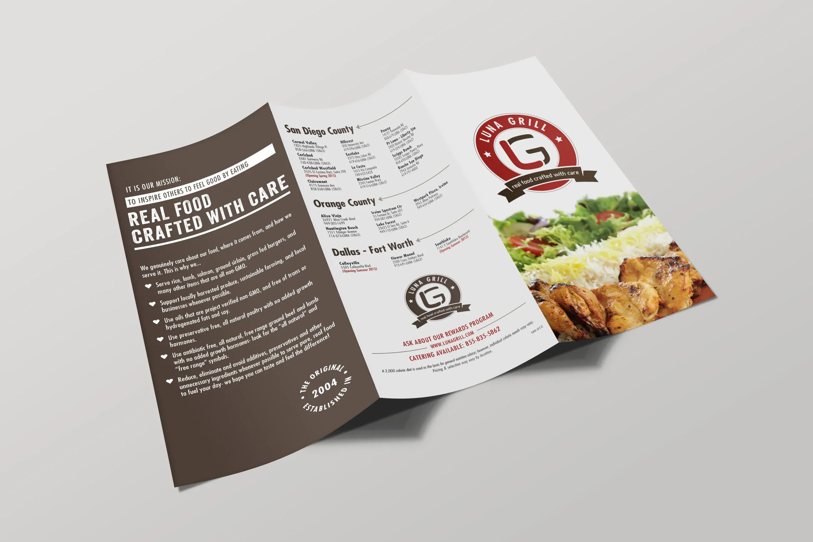 The Luna Grill trifold menu, outside spread, with the logo badge and its real food crafted with care ribbon beside the mission panel