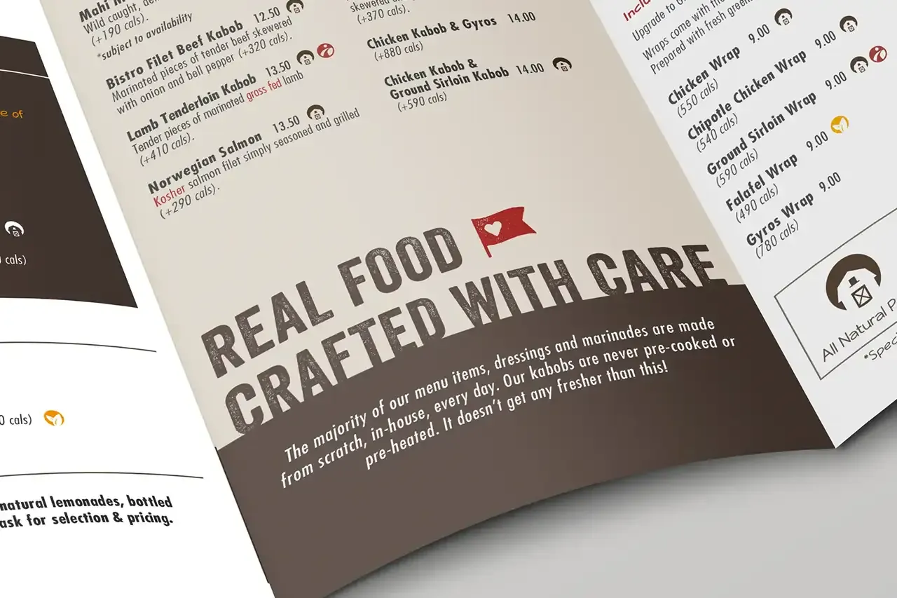 The real food crafted with care tagline with its heart flag, set large across the inside of the menu