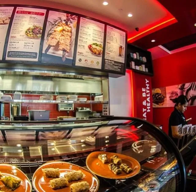 A red interior with menu boards above the counter